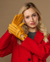 Yellow lambskin driving gloves with touchscreen fingertips and stitched holes