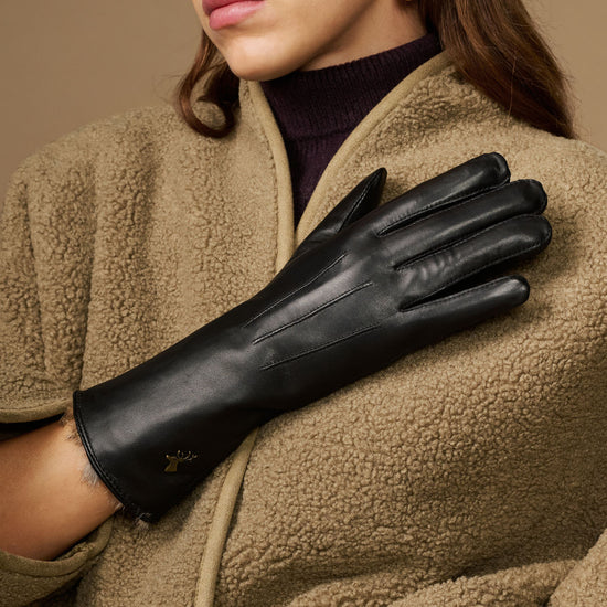 Black leather gloves with long sleeves, fur lining at wrist, and touch icon
