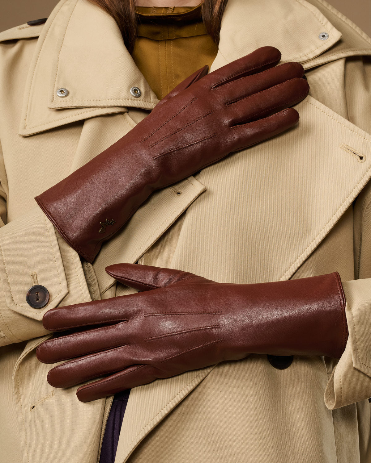 Extra-long brown leather gloves with rabbit-fur lining at the cuffs