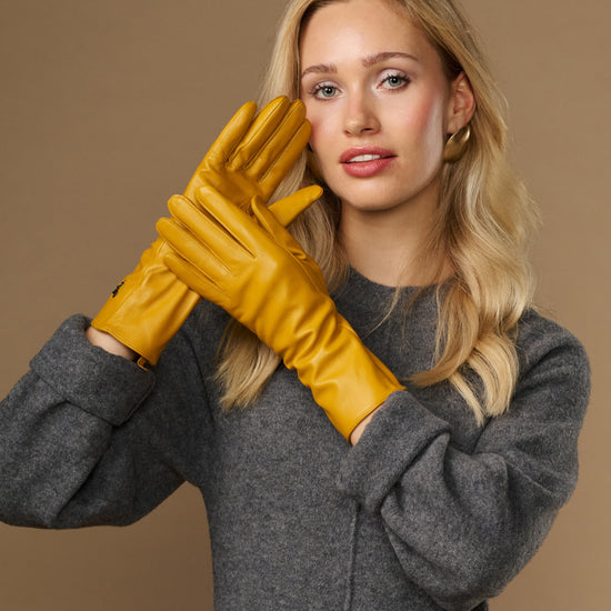 Yellow extra-long leather gloves with cashmere lining, logo on cuff, touchscreen fingertips