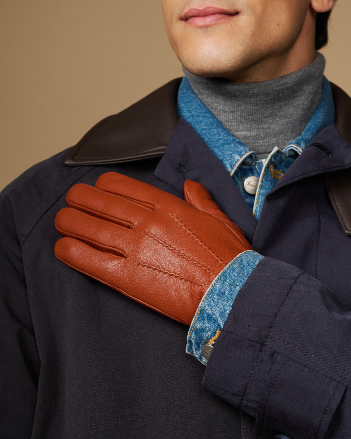 Cognac leather touchscreen glove with blue wool lining cuff, side view