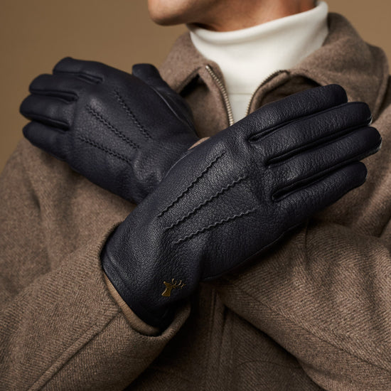 Men's navy leather gloves with wool lining, gold logo on palm and diagonal seam