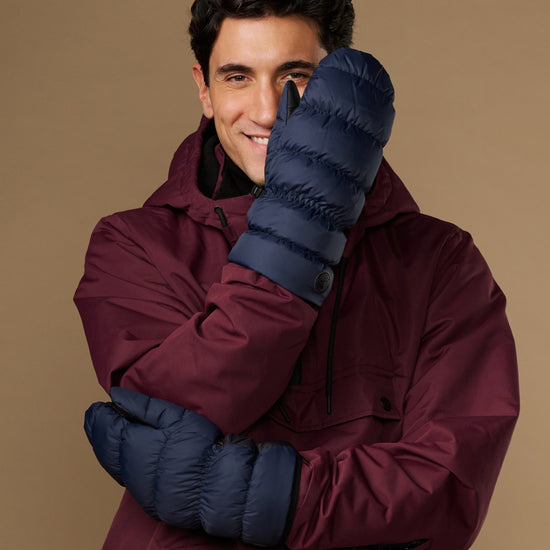 Blue insulated mittens with quilted pattern and wraparound wrist strap