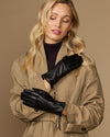 Black leather gloves with side zipper, held together in front view