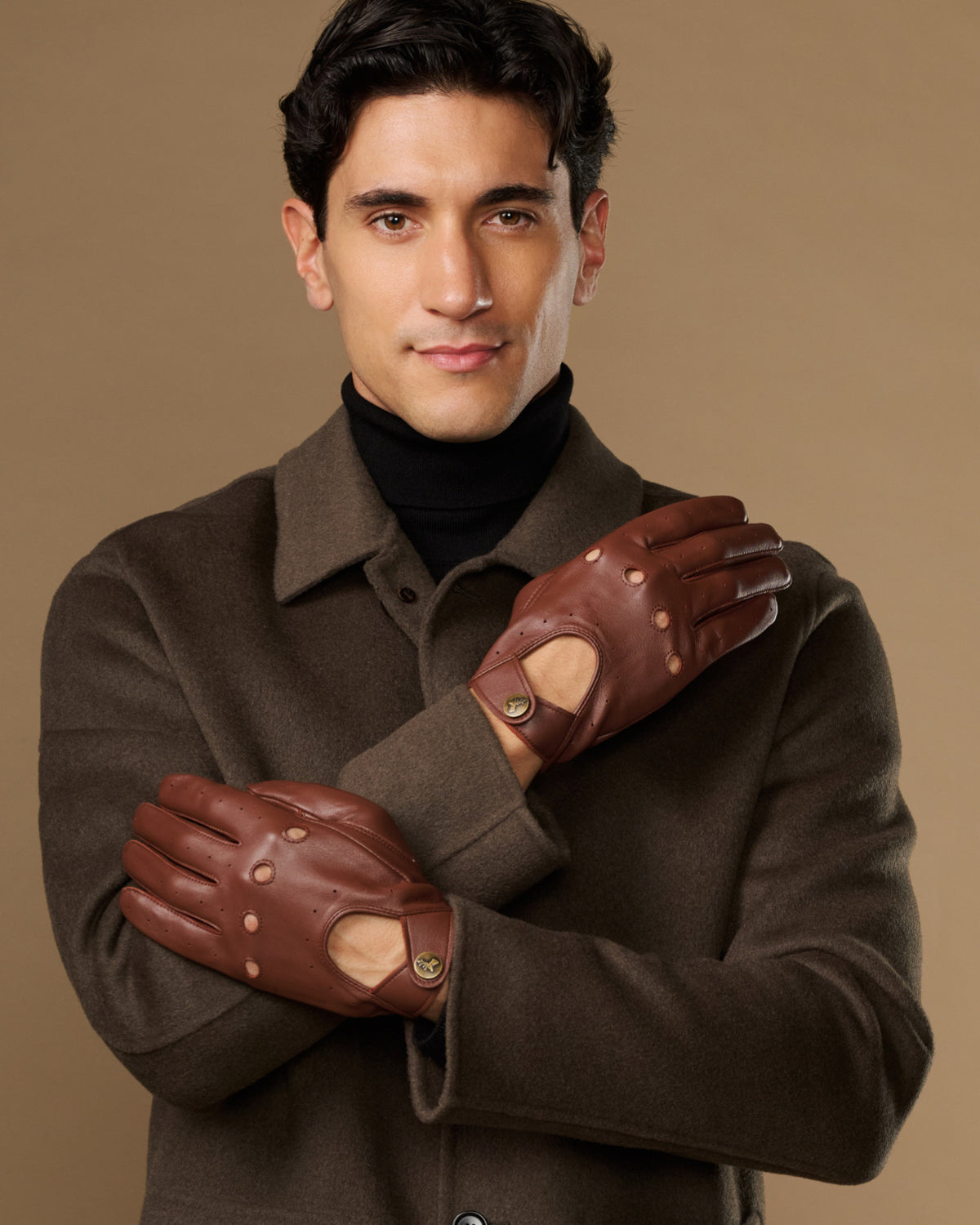 Men's brown leather driving gloves with stud details and touchscreen patch