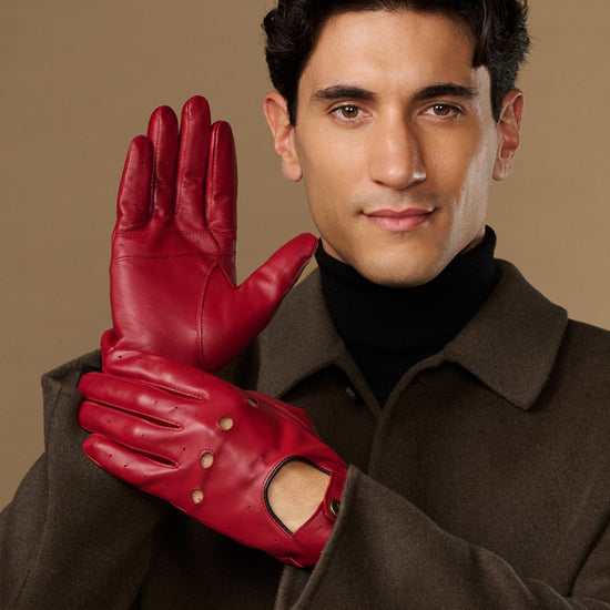 Men's red leather driving gloves with five-finger design and metal stud accents
