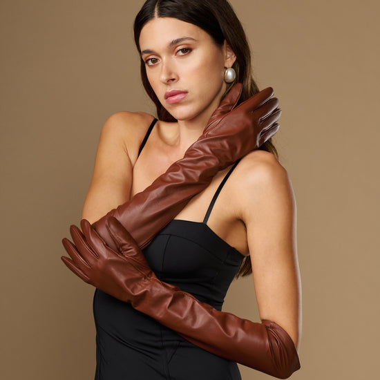Chocolate brown leather elbow gloves with long fitted sleeves and tapered fingers