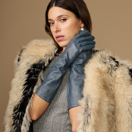 Women’s grey below-elbow leather gloves with long cuffs and close hand fit