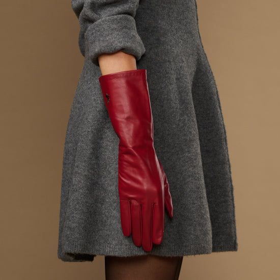 Red leather mid-forearm gloves with long cuff and stitched finger panels