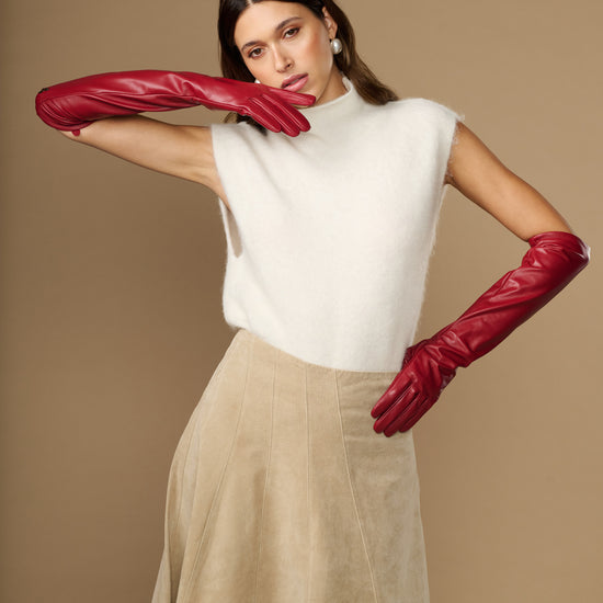 Red leather elbow gloves with padded-looking lining at wrist