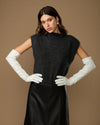 Women's white leather gloves with long cuffs, held together at waist
