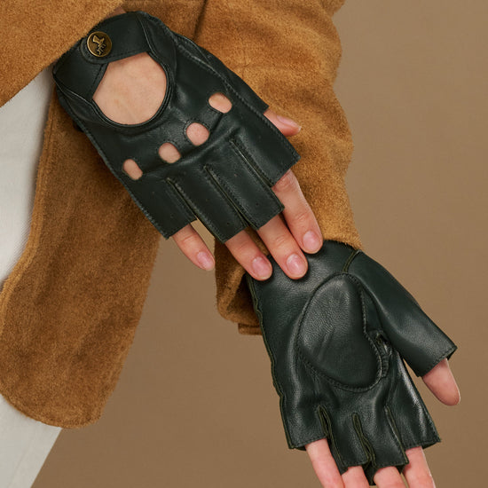 Dark green fingerless lambskin driving gloves with oval thumb cutout and seams