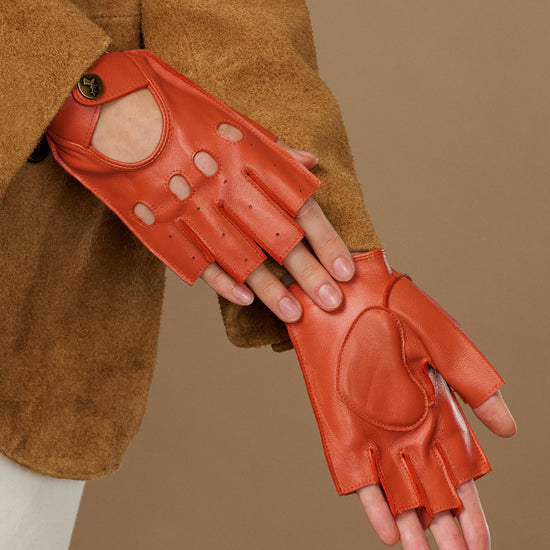 Orange fingerless driving gloves with stitched palm panels and thumb oval cutout