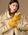 Yellow deerskin leather gloves with stitched knuckles and snug wrist cuff