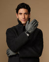 Men's classic gloves crossed: dark felt gloves with gray herringbone detail at wrist.