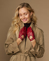 Women’s red leather driving gloves with perforations and button-detail cuff